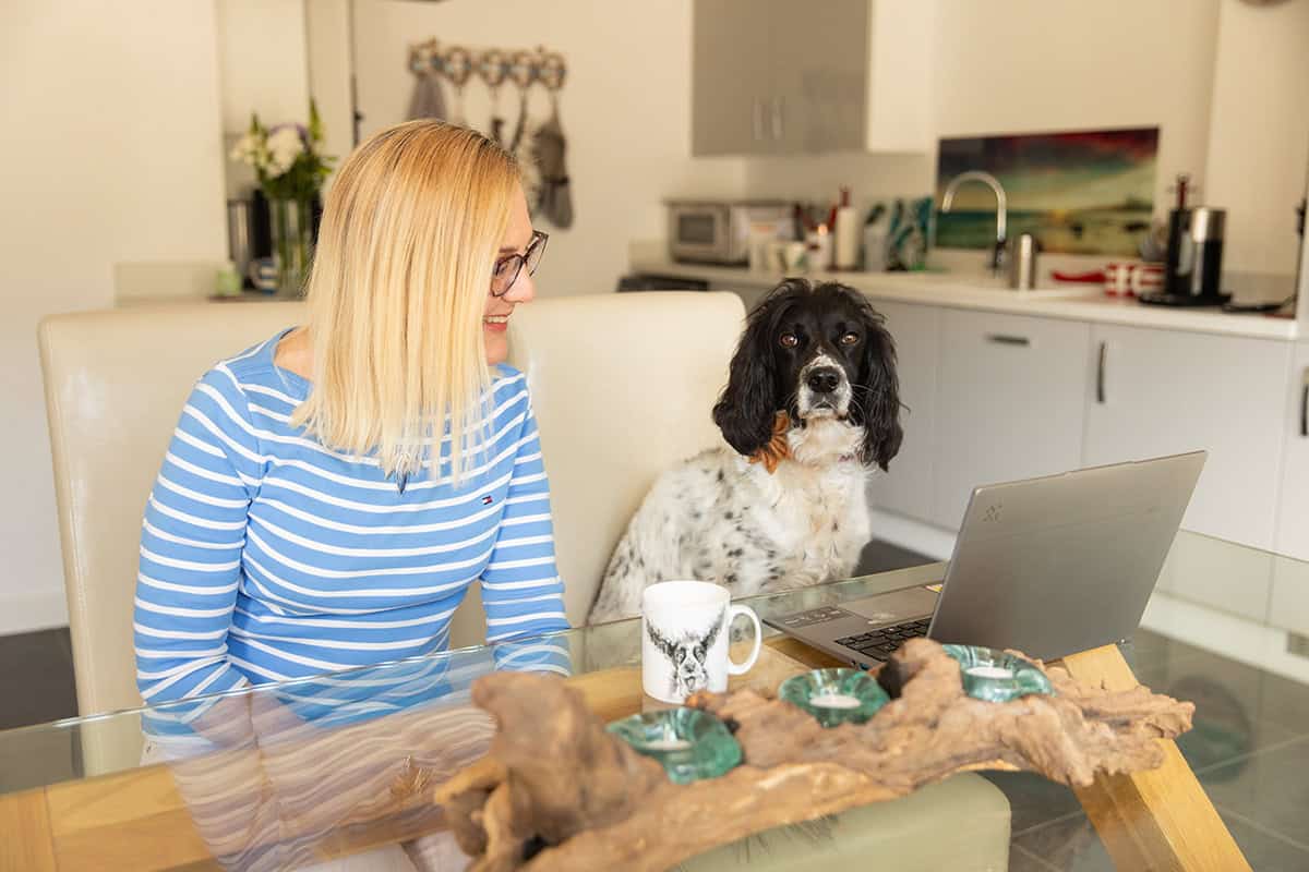 Fiona Pedley and Kensi the dog working from home